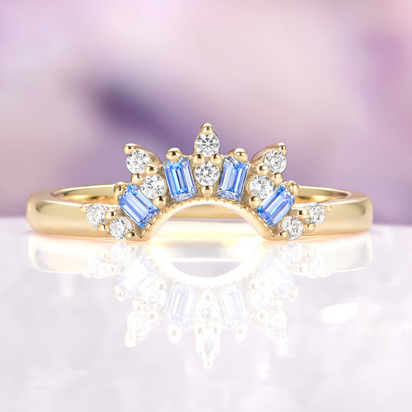Blue Moissanite Crown Band in 14K Yellow Gold by Aquamarise Gold, showcasing pastel blue baguette moissanites and sparkling round stones arranged in a delicate crown design, part of Women’s Wedding Bands, Birthstone Jewelry, and Gold Rings collections.