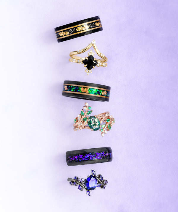 Collection of various rings with gemstones on a light purple background