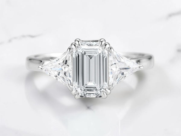 Three stone engagement ring by Aquamarise shown in a ring style banner