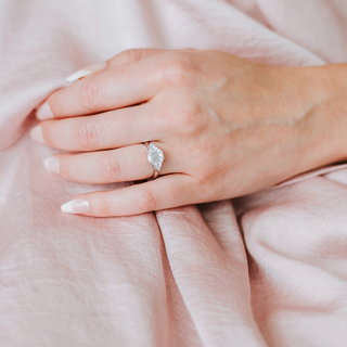 Emerald cut engagement rings by Aquamarise with step-cut center stones