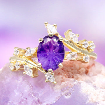Amethyst and Galaxy Fire Opal Leaf Couples Ring Set by Aquamarise featuring a vibrant purple amethyst center stone with marquise and round white opal accents set in polished gold, from Matching Couples' Rings and February and October Birthstone collections.