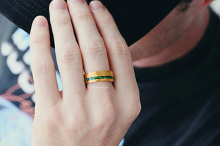 Victoria Vintage Emerald Couples Ring Set on a hand, showcasing gold bands with green emerald accents, by Aquamarise, part of matching couples' rings and meaningful jewelry gifts collections.