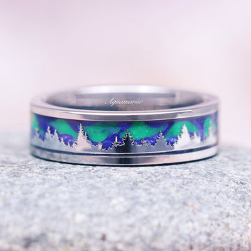 Aurora Borealis Forest Couples Ring Set- Northern Lights & Trees featuring a detailed silhouette of a forest with shimmering green and blue northern lights inlay on a polished silver band by Aquamarise, inspired by celestial and nature themes.
