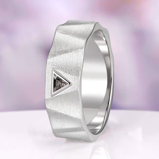 Silver ring with geometric design and triangle cutout on a gradient background