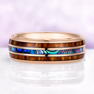 abalone shell tungsten wedding band ocean inspired ring on purple background