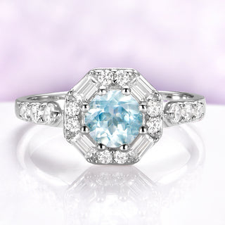Vintage Octagon Halo Round Aquamarine Ring in Sterling Silver by Aquamarise, featuring a 0.85 carat aquamarine center with baguette and round simulated diamonds in a vintage halo design.