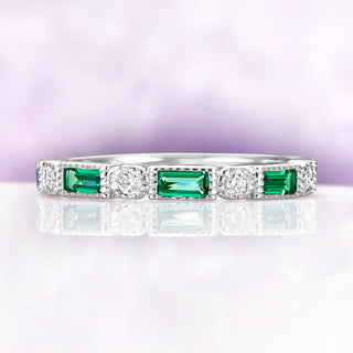 Art Deco Emerald Milgrain Wedding Band in Sterling Silver by Aquamarise, featuring emerald-cut green stones and round diamonds with milgrain detailing on a polished silver band.