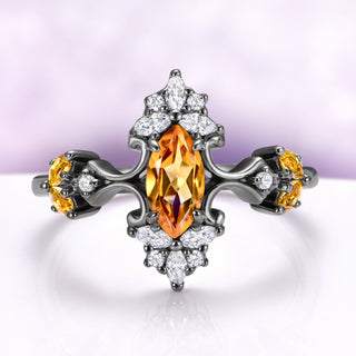 Natural citrine engagement ring in black ruthenium with marquise center and scrolled shoulders