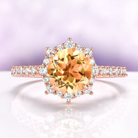 Aster Round Cut Citrine Ring in 14K Rose Gold Vermeil by Aquamarise, featuring a round citrine center with a snowflake halo of simulated diamonds on a pavé rose gold vermeil band.