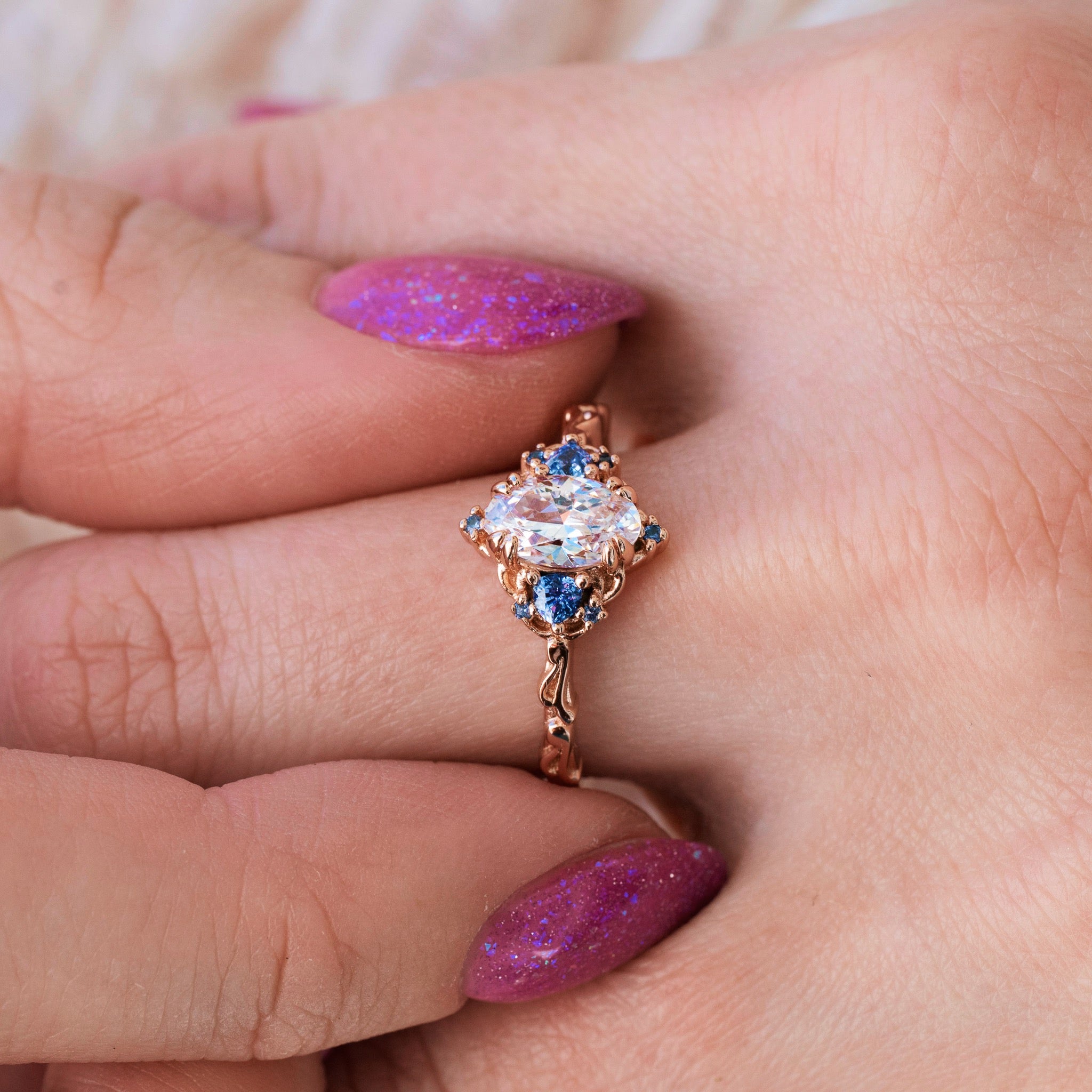 Diamond and alexandrite engagement ring pairing a color-change alexandrite with colorless diamonds