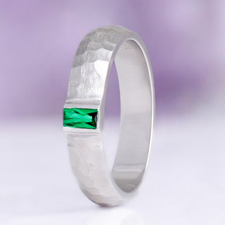 Bezel Emerald Hammered Wedding Band in Sterling Silver (5.5mm) by Aquamarise, a hammered rhodium-finished band with a bezel-set baguette emerald.