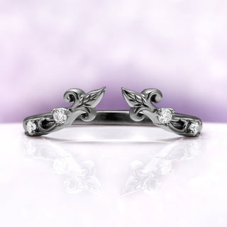 The Carmilla enhancer band on its own in black ruthenium, an open leaf and vine wrap set with moissanite