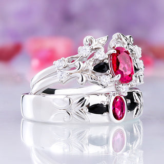 Angled view of the Carmilla ruby and black onyx bridal set beside the matching men's band, sold together as a couples set