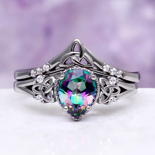 Celtic Knot Mystic Topaz Ring Set in Black by Aquamarise, with a pear-cut mystic topaz and Celtic knot detailing on a black band.