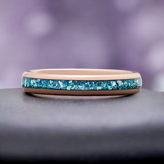 Side profile of the 4mm rose gold tungsten band with aquamarine inlay