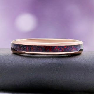 Side profile of the 4mm rose gold tungsten band with black opal inlay