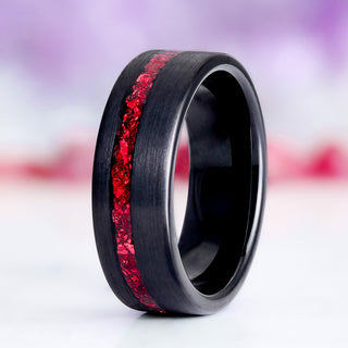 Crushed Ruby Mens Tungsten Ring (8mm) by Aquamarise, featuring a black tungsten band with half-brushed finish and a vibrant off-center crushed ruby inlay for a bold, modern look.