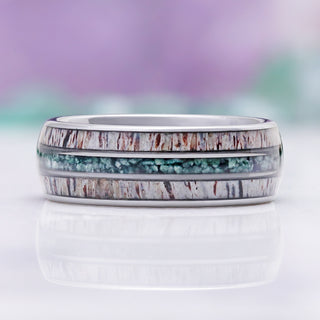 Side profile of the antler and moss agate inlays framed by polished silver tungsten edges