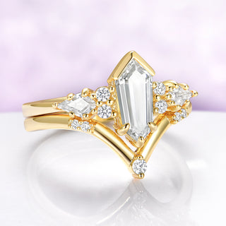 Elongated hexagon lab diamond engagement ring with dagger shape center stone and chevron band in 14K yellow gold.