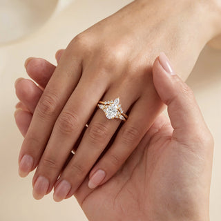 Close-up of a hand wearing a diamond ring on a beige background