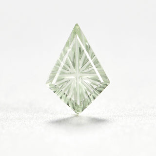 Faelight Cut lab-grown green sapphire kite 7 x 10 mm loose gemstone, concave starburst facets, on white
