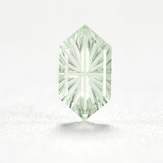 Faelight Cut lab-grown green sapphire long hexagon 5 x 9 mm loose gemstone, concave starburst facets, on white