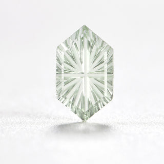 Faelight Cut lab-grown green sapphire long hexagon 6 x 10 mm loose gemstone, concave starburst facets, on white