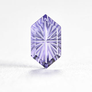 Faelight Cut lab-grown lavender purple sapphire long hexagon 5 x 9 mm loose gemstone, concave starburst facets, on white