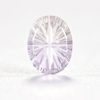 Faelight Cut natural ametrine oval 6 x 8 mm loose gemstone, concave starburst facets, on white