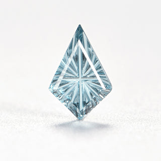 Faelight Cut natural sky blue topaz kite 6 x 9 mm loose gemstone, concave starburst facets, on white