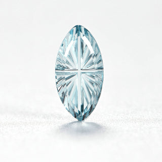 Faelight Cut natural sky blue topaz marquise 5 x 10 mm loose gemstone, concave starburst facets, on white