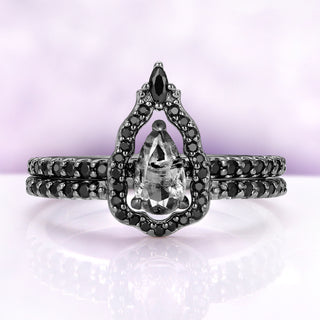 Herkimer diamond engagement ring set in black ruthenium — pear natural Herkimer on a black onyx pavé band with an open mirror halo band by Aquamarise