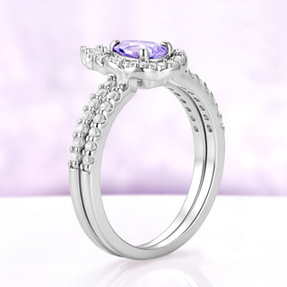 Side profile of the two rings stacked, showing the low prong setting and the matching pavé shanks