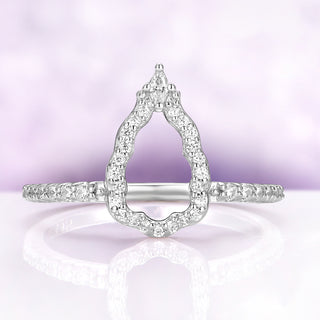 Open halo mirror band shown on its own, pear-shaped frame of simulated diamonds with a marquise accent at the top