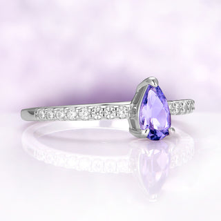 Angled view of the pear lavender sapphire solitaire alone in sterling silver