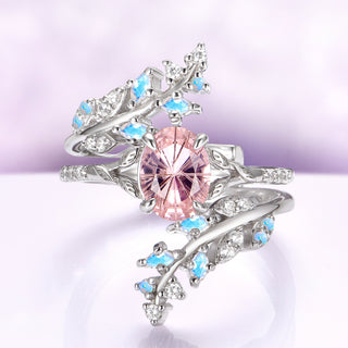 Fireworks Cut Morganite & Moonstone Leaf Couples Ring Set by Aquamarise, featuring a radiating pink morganite and glowing moonstone accents in an elegant sterling silver leaf design.