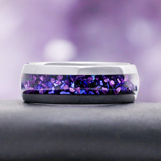 Galaxy Crushed Alexandrite & Fire Opal Wedding Band in Tungsten Carbide (8mm) by Aquamarise, resting on a grey stone pedestal.