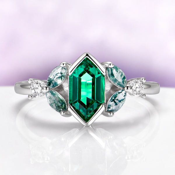 Hexagon Emerald & Moss Agate Leaf Engagement Ring in 14K White Gold by Aquamarise Gold, featuring a hexagon emerald center with moss agate marquise and white gold band design.