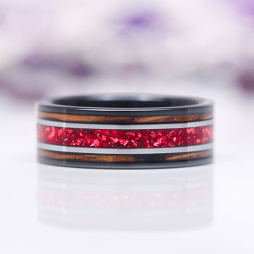 Unique Fireworks Cut Garnet & Whiskey Barrel Couples Ring Set by Aquamarise featuring a bold ring with sparkling red garnet inlay framed by warm whiskey barrel wood accents and black finish, part of Matching Couples' Rings and Best Selling Jewelry collections.