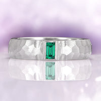 Hammered Emerald Wedding Band in 14K White Gold (5.5mm) featuring a hammered brushed finish with a rectangular emerald centerpiece, embodying timeless elegance by Aquamarise Gold.