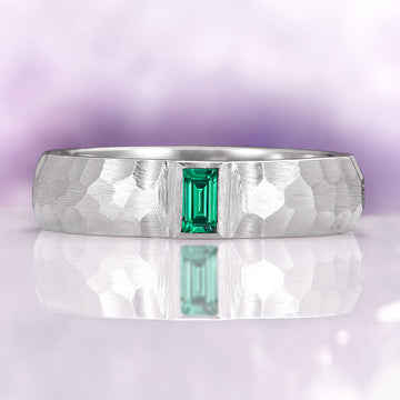 Hammered Emerald Wedding Band in 14K White Gold (5.5mm) featuring a hammered brushed finish with a rectangular emerald centerpiece, embodying timeless elegance by Aquamarise Gold.