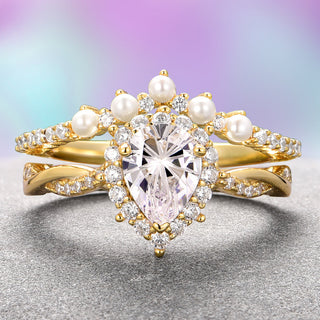 Gold ring with heart-shaped diamond and pearls on a gradient background