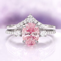 Bella Oval Cut Pink Sapphire Engagement Ring Set in 14K White Gold by Aquamarise Gold featuring an oval pink sapphire with diamond accents on a polished white gold band.