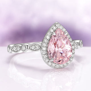 Teardrop Morganite Ring in Sterling Silver by Aquamarise, featuring a pear-shaped pink morganite center with a halo of diamonds and a detailed sterling silver band.