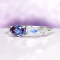 Alexandrite & Moonstone Dainty Engagement Ring in 14K White Gold featuring a pear-shaped alexandrite, marquise moonstone, and small diamond accent in a delicate band design.