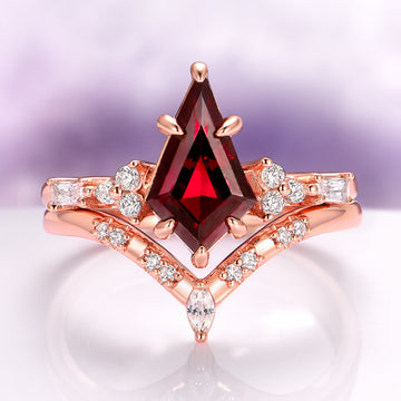 Garnet & Red Fire Opal Whiskey Barrel Couples Ring Set by Aquamarise featuring a striking kite-cut garnet with marquise and round diamond accents in a rose gold setting.