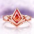 Padparadscha Sapphire Engagement Ring Set in 14K Solid Rose Gold by Aquamarise Gold, featuring kite-cut orange sapphire with moissanite accents in a modern, elegant design.