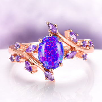 Starry Night Van Gogh Fire Opal & Rose Gold Leaf Couples Ring Set by Aquamarise, featuring a vibrant oval fire opal centerpiece surrounded by delicate violet gemstones and rose gold leaf-inspired accents, part of Matching Couples' Rings and October Birthstone collections.