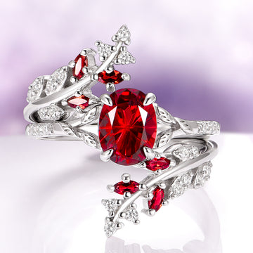 Red Garnet Leaf Ring Guard in 14K White Gold by Aquamarise Gold featuring a vibrant oval red garnet centerpiece with leaf and vine motifs accented by smaller red garnets and brilliant diamonds, part of January Birthstone Jewelry and Nature Inspired Jewelry Collection.