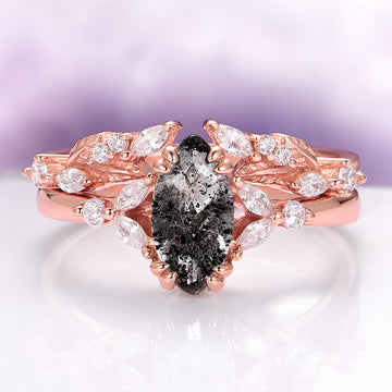 Galaxy Salt and Pepper (Herkimer) Diamond & Meteorite Couples Ring Set by Aquamarise, featuring a rose gold band with an oval salt and pepper diamond centerpiece surrounded by leaf-shaped white gemstones, blending celestial charm with romantic elegance.